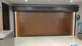 Wooden theme garage door in a modern interior setting